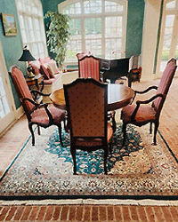 Traditional Green Persian Design Rug in Dining Room