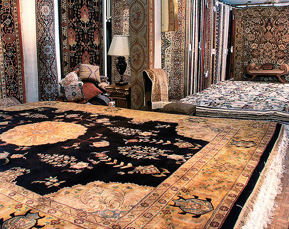Nejad showroom interior select view featuring hand knotted traditional Signature rug with medallion