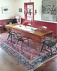 Dining Room featuring antique Persian Heriz rug