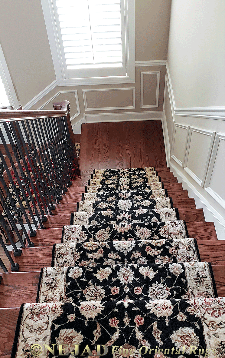 Rug runner installation on staircase in elegant Philadelphia area estate home